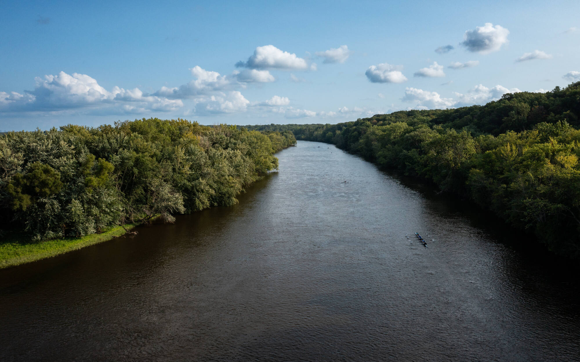 Rowing team practices on the Grand River